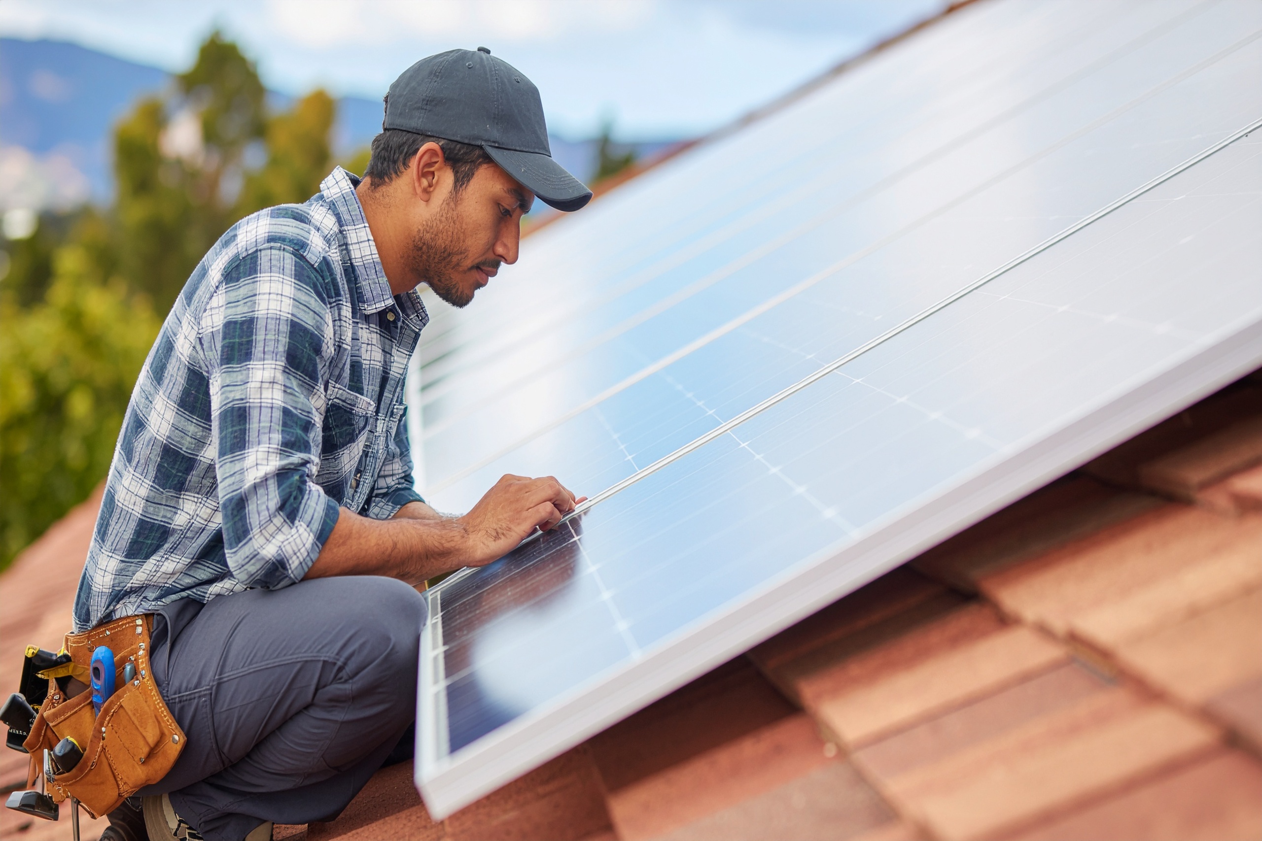 vecteezy installer carefully fitting solar panels on a rooftop 69823037
