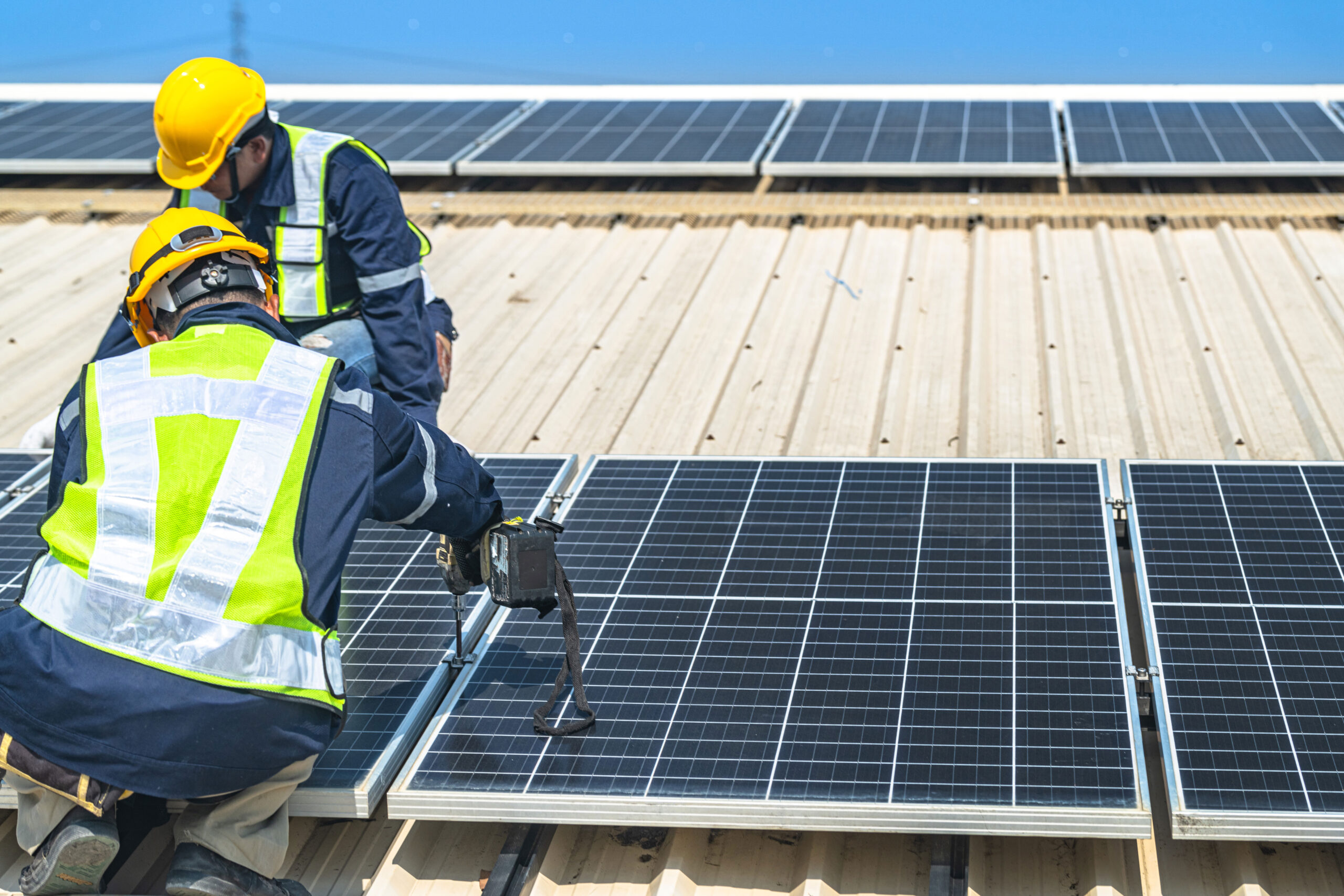 worker technicians are working to construct solar panels system